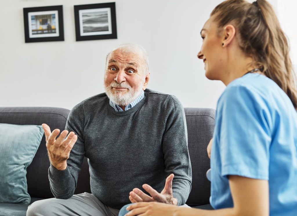 senior home care nurse taking care of elderly man who is laughing in Edmonton, AB